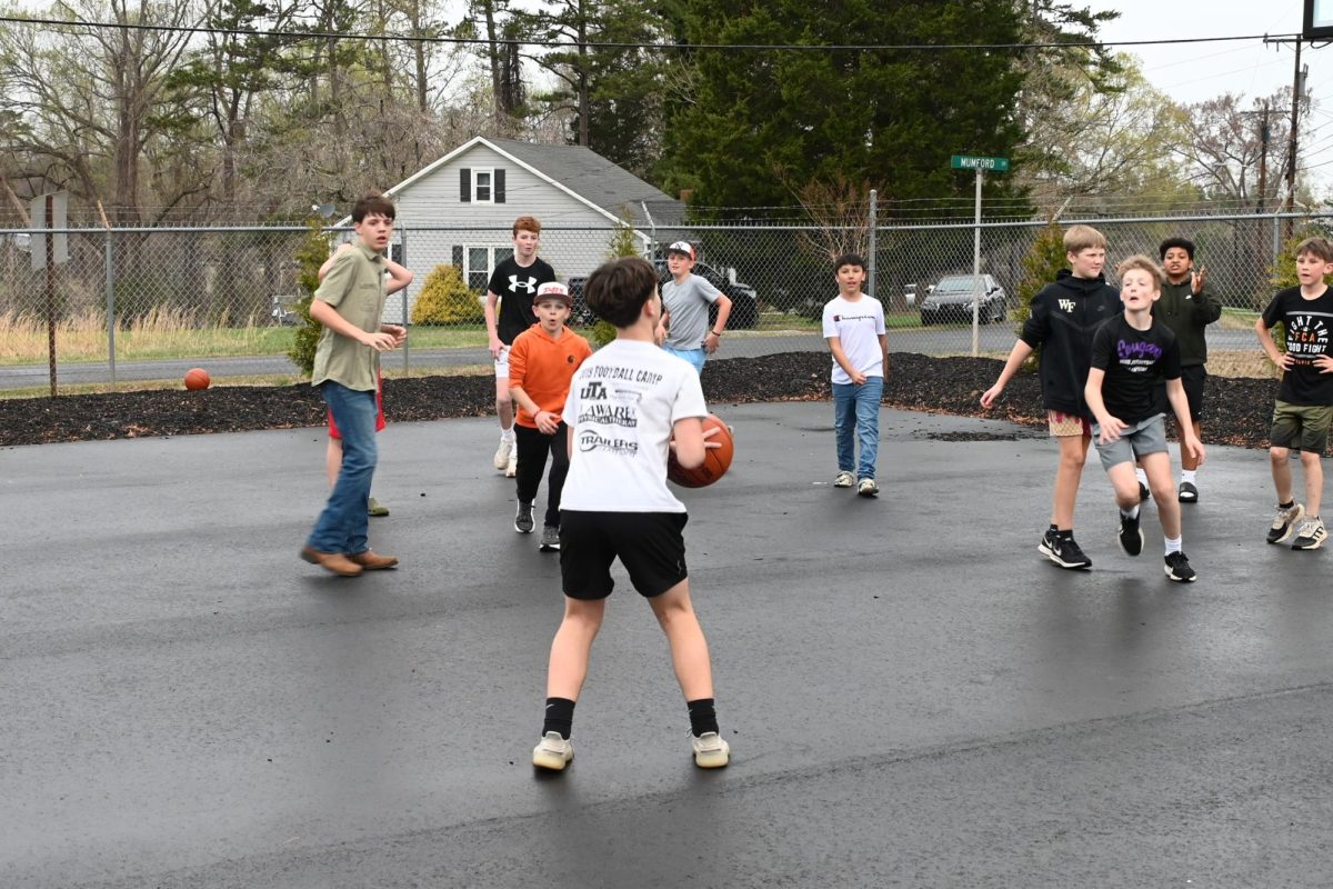 Middle School students played basketball outside of Rescue House before the event started. 