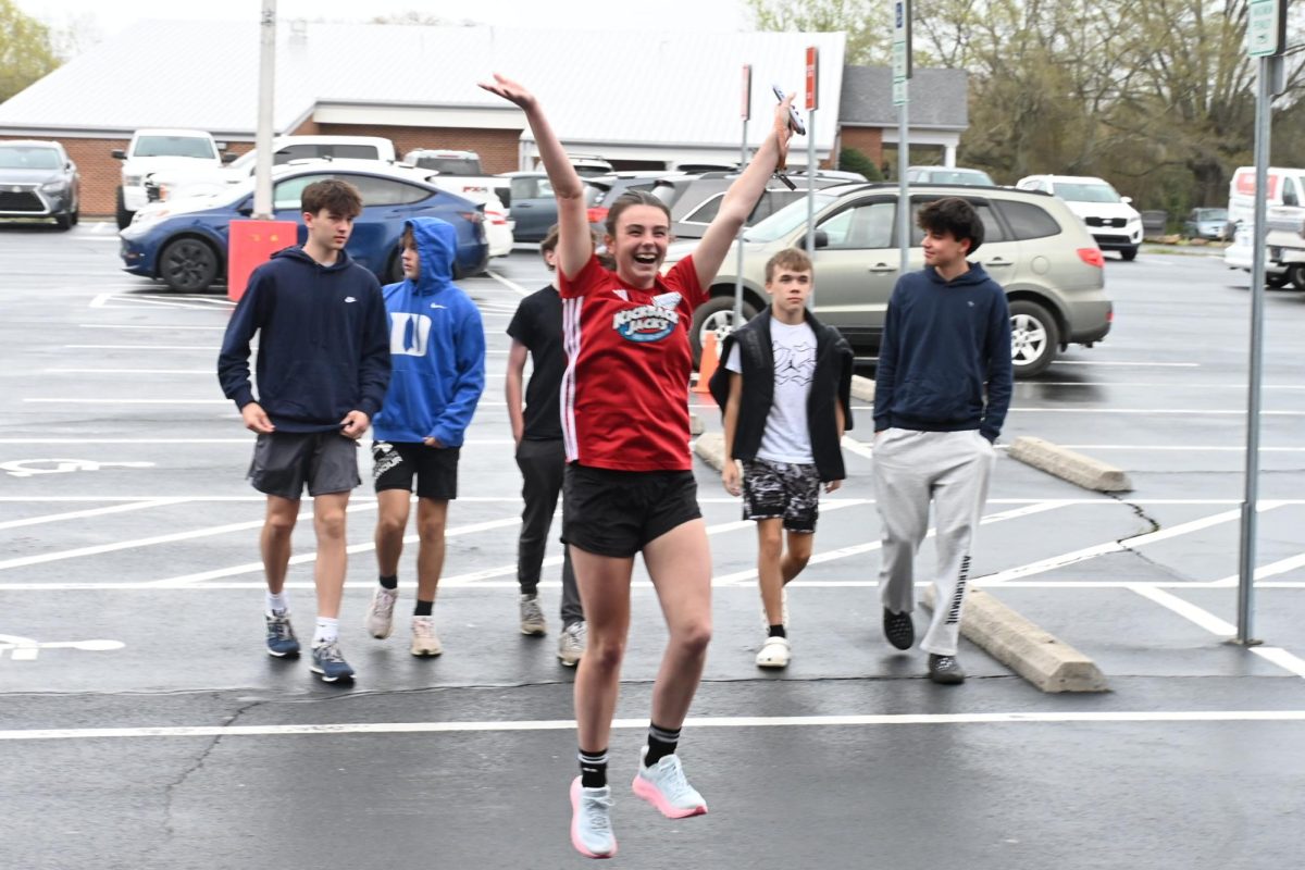 Caroline Mitchell rejoices in excitement as she sees her friends welcoming her into the event. 