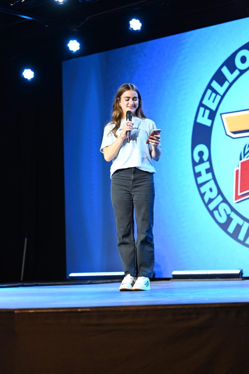 Meredith Harpe, the Co-President of FCA, welcomes everyone into Courts of Christ and shares the schedule. 