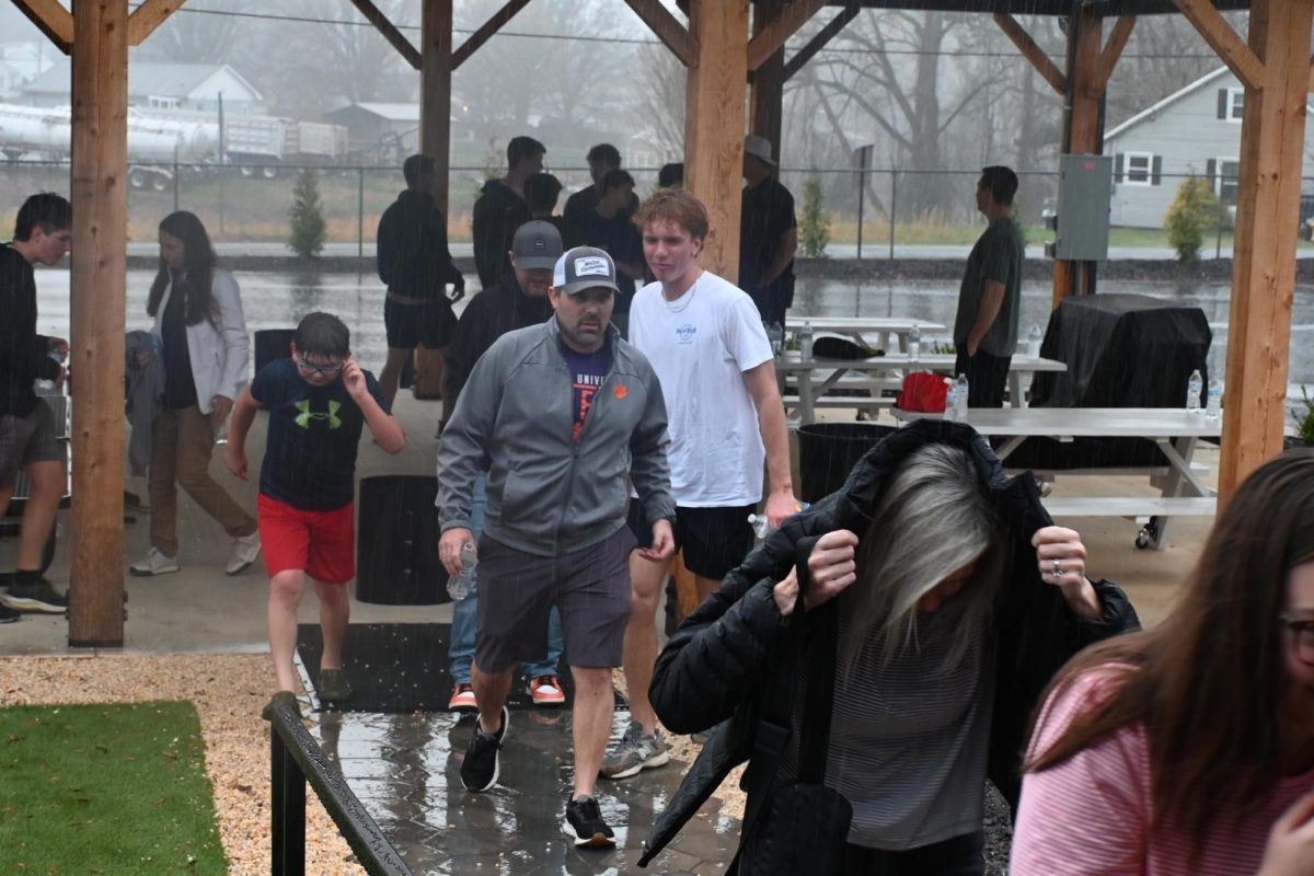 Before the event started the rain led everyone who was outside at the activities to rush inside. 