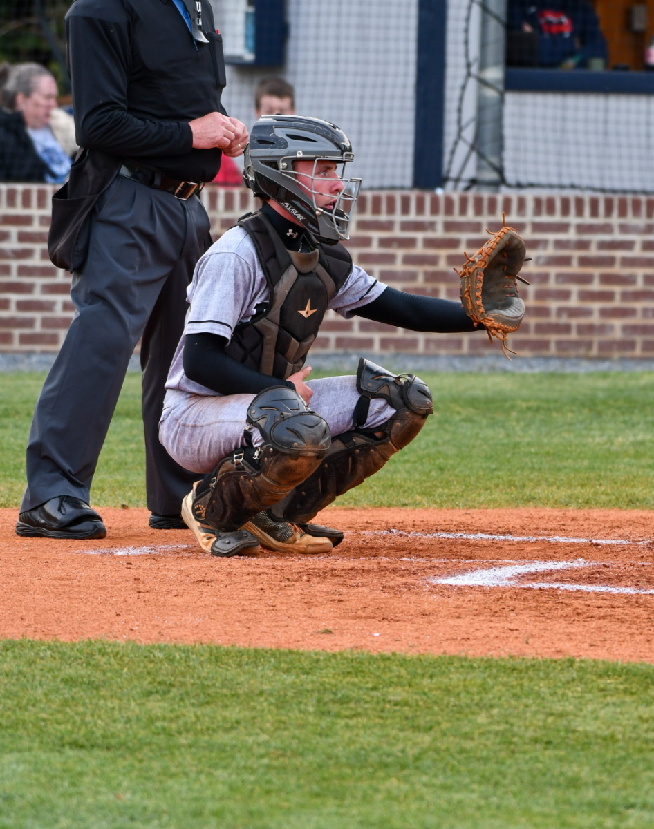 Tanner Steinour gets ready as the pitcher Ian Patton throws the ball down to him.