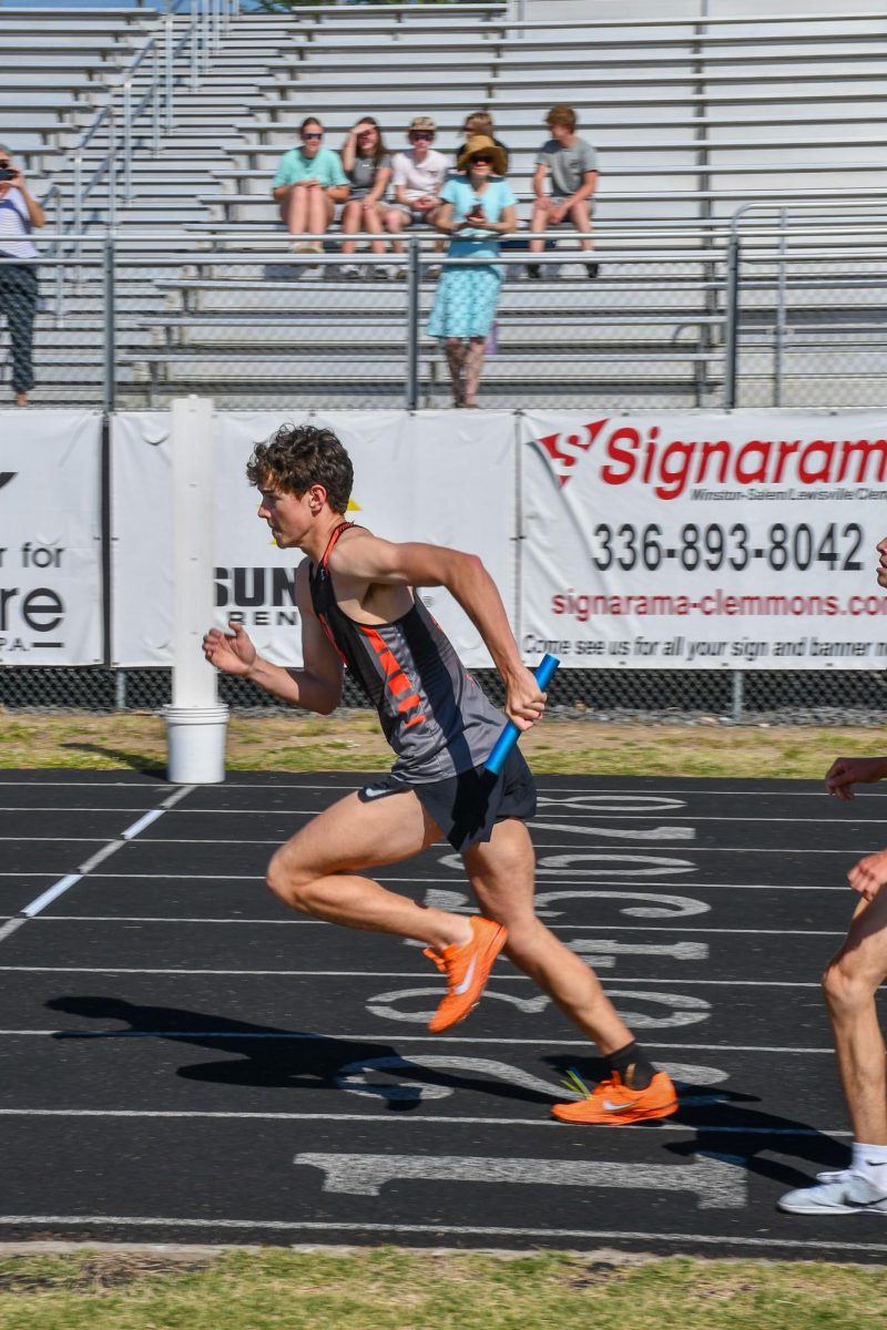 Ethan Lakey utilizes his explosivness to start his leg of the race. 