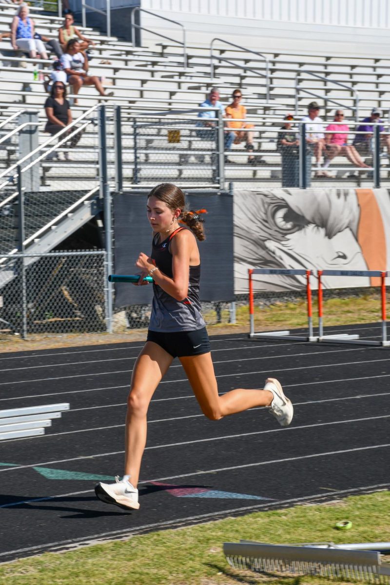 Kristen Starkey runs the 4x8, taking the race stride by stride. 