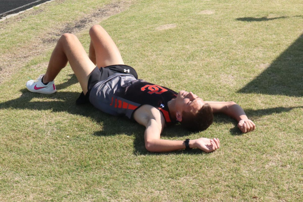 Avery Van Lente catches his breath after running his heat. 