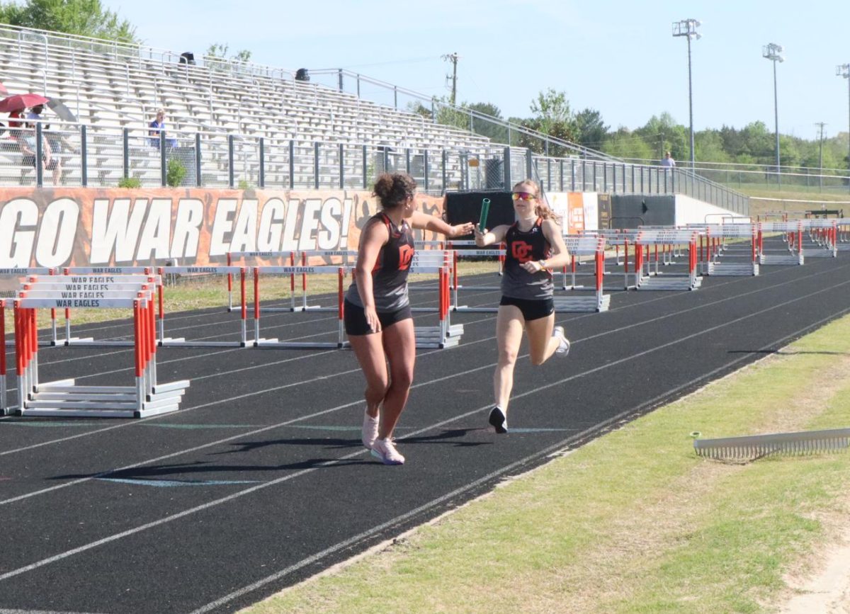 Lexi Marion passes off the baton in the 4x8 to Rachel Starkey. 