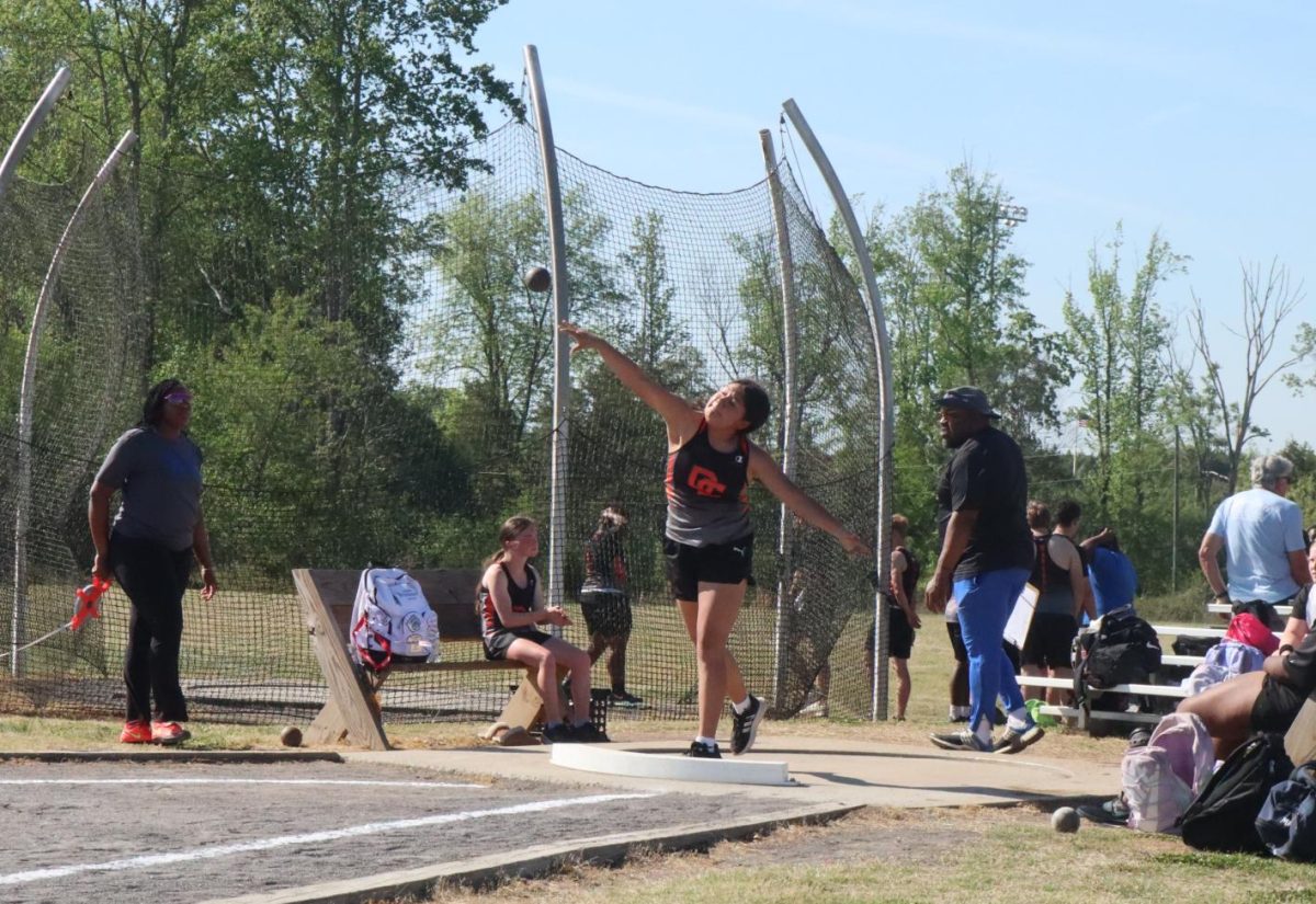 Emily Hernedez throws the shotput, attempting to get a personal record. 