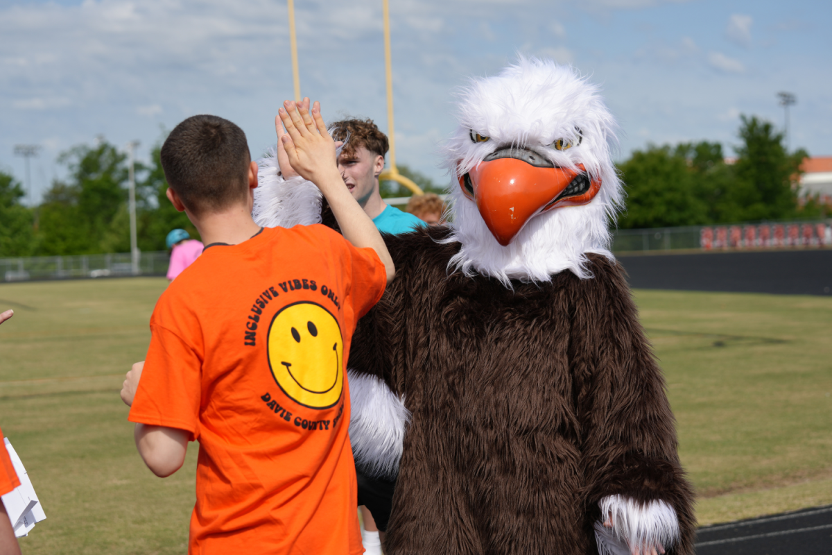 The Davie County High school mascot, Edward the Eagle, awaited the athletes at the end of the race. Encouraging them until they reached him where he greeted them with a high five. 