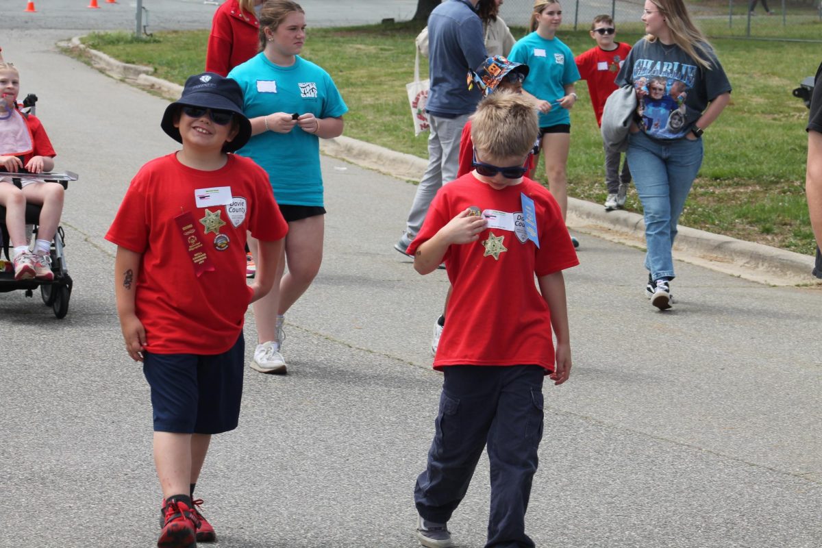 Shady Grove's Marshall and Lucas walk towards the activities at North Davie after being made honorary deputies. This honor allowed them to get their own badges, and spend time with the K-9 Briar. 
