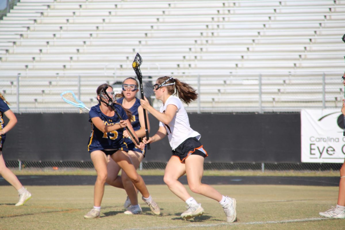 Kayden Richardson drives into the 8 meter, scouting out how to make a goal. 