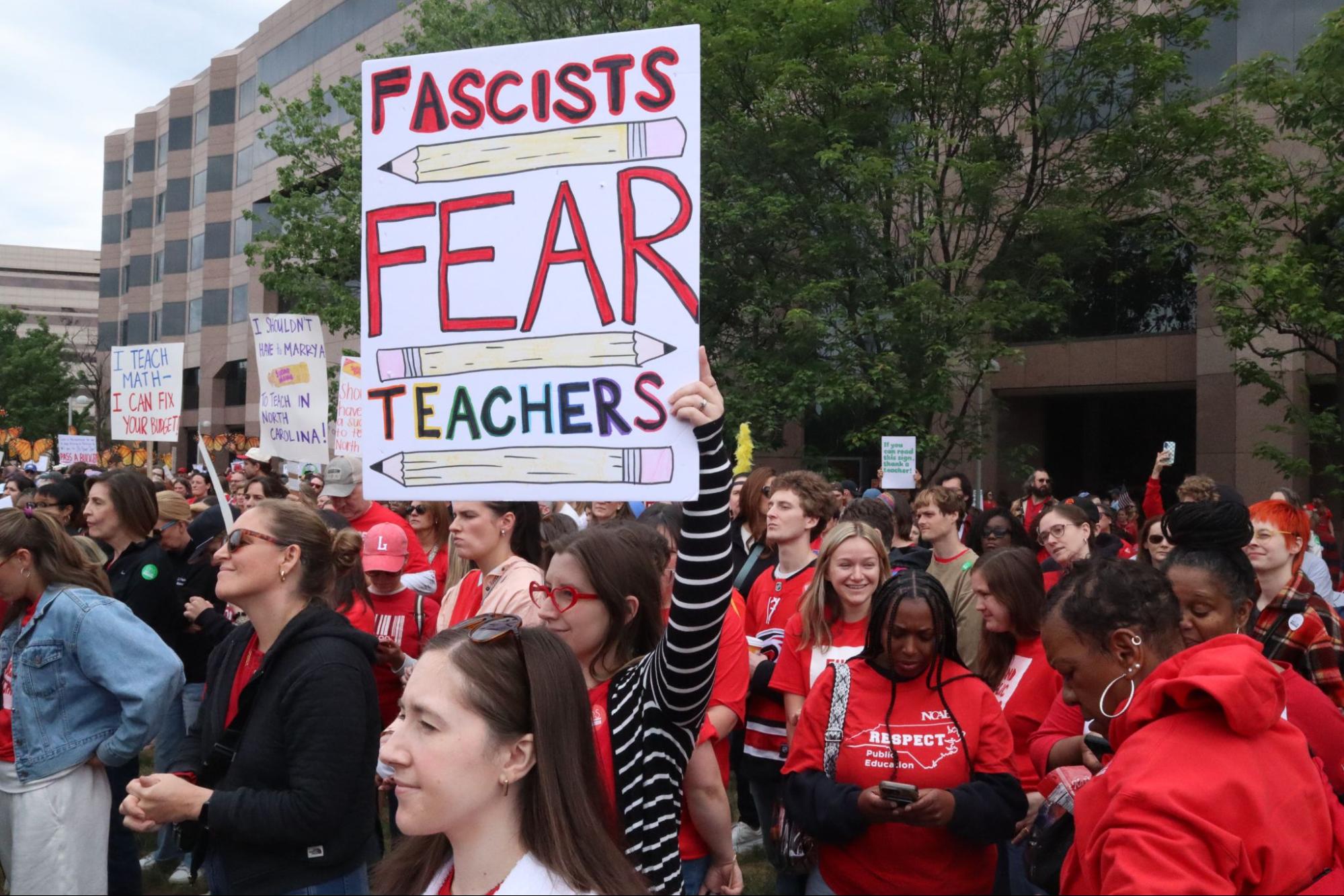A group of teachers assembled on Halifax Mall listen to a speaker as they wait to march around the North Carolina General Assembly. | Photo courtesy Matt Barker
