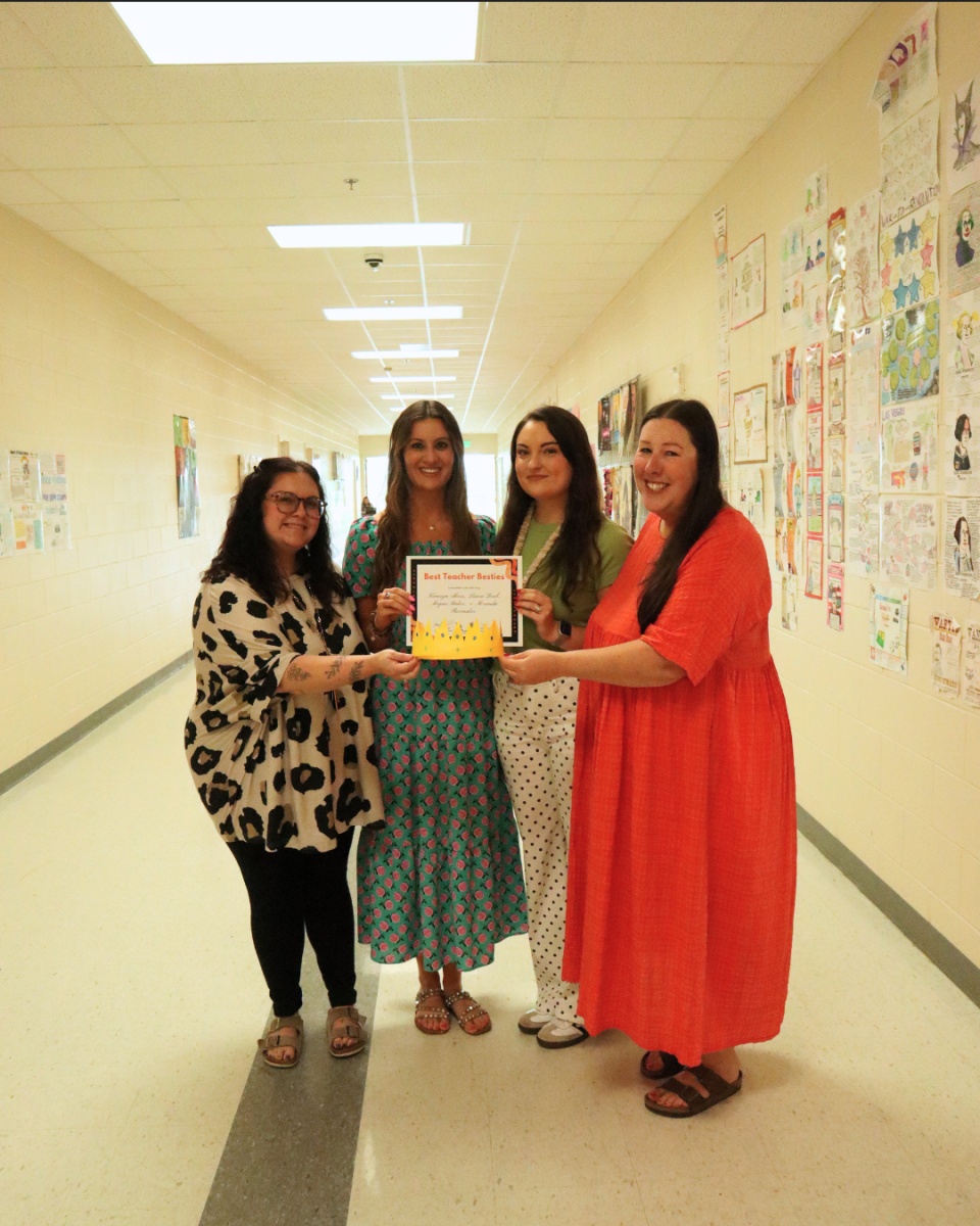 Teacher besties Kamryn Akers, Laura Doub, Meranda Shoemaker, and Megan Baker pose with their award.