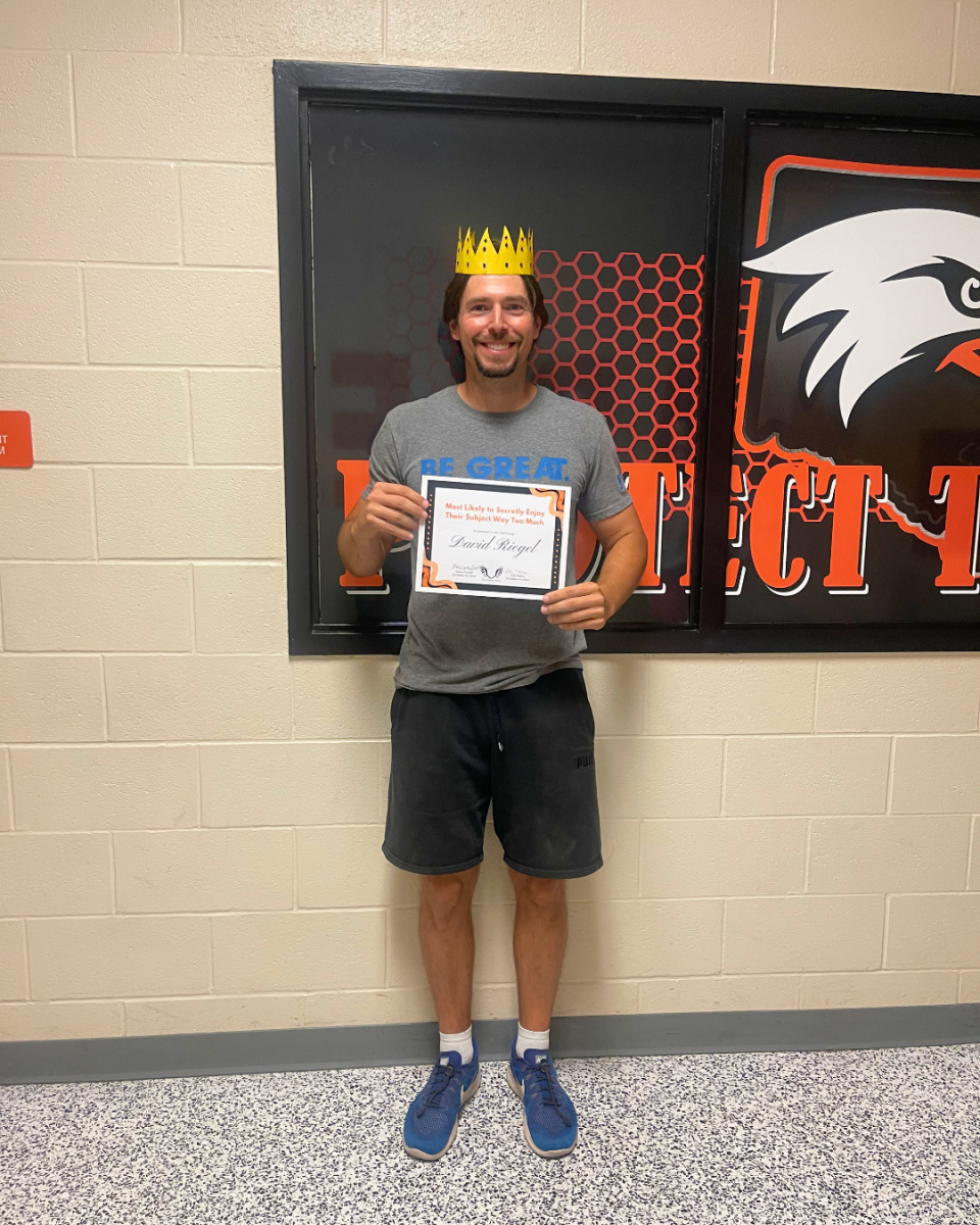 David Riegel poses with his Student Choice Award just outside the weight room at Davie High.