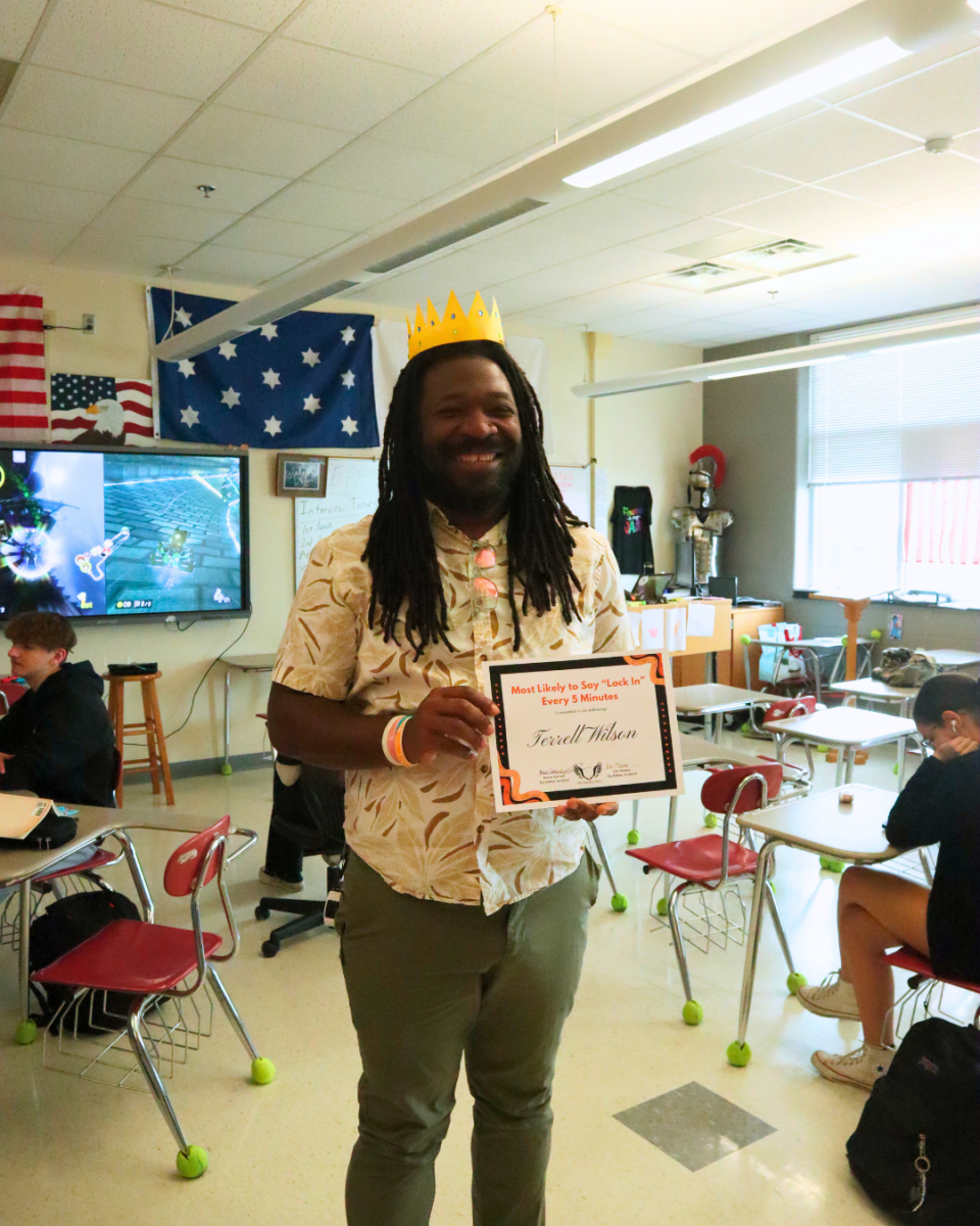 Terrell Wilson locks in and strikes a pose with his Student Choice Award in hand.