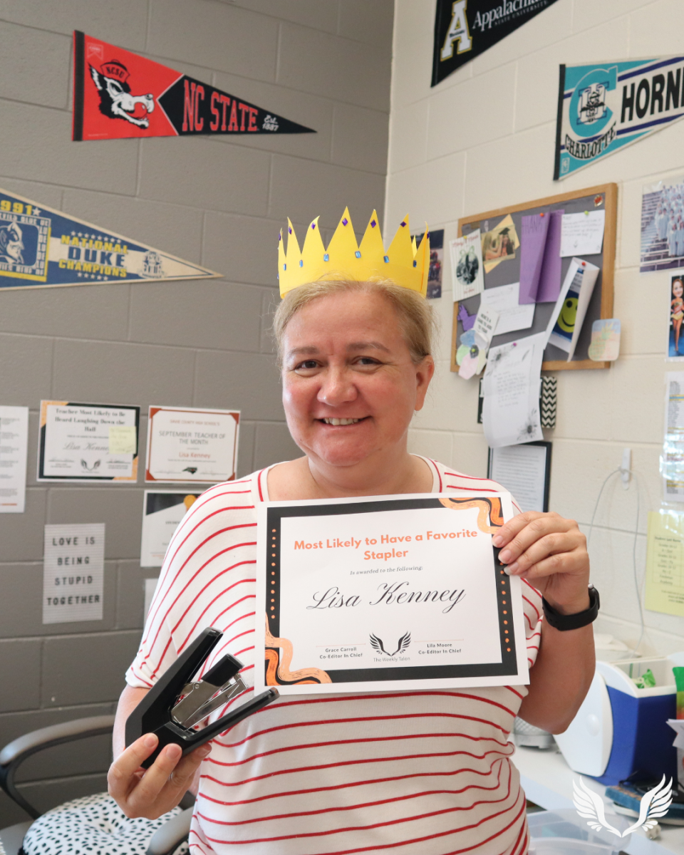 Lisa Kenney poses with her favorite stapler and her Student Choice Award.